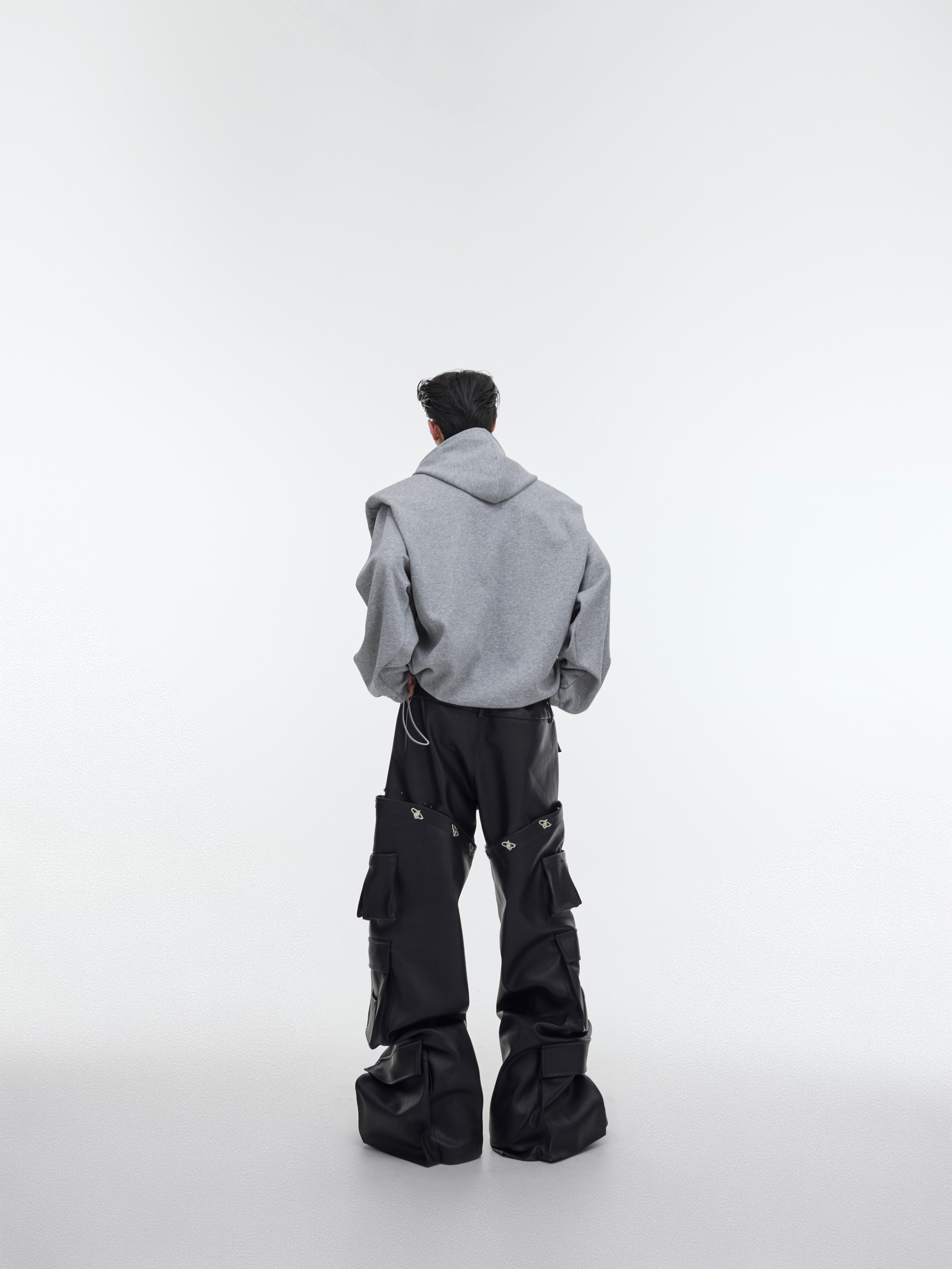 Elevate Your Style with the Deconstructed Pleated Shoulder Pad Hoodie in Luxurious Plush Fabric