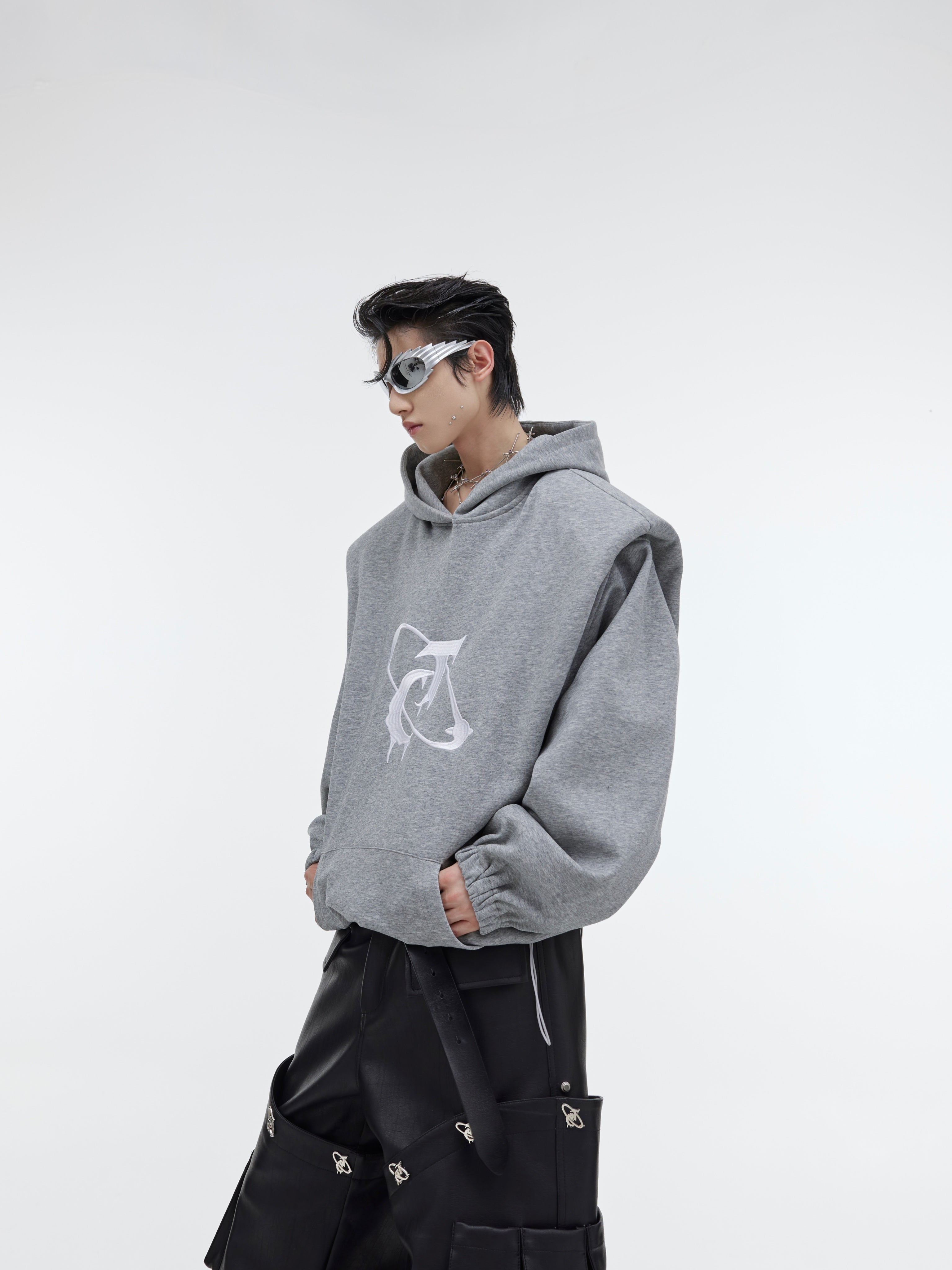 Elevate Your Style with the Deconstructed Pleated Shoulder Pad Hoodie in Luxurious Plush Fabric